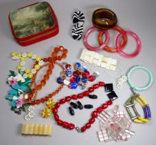 A quantity of costume jewellery - including a jade coloured floral cast bangle.