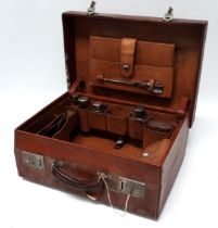 A 20th century tan leather gentleman's dressing case - by Hill of Newmarket, with a fitted interior,