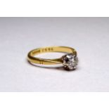 An 18ct yellow gold solitaire diamond ring - with an illusion setting, ring size N, weight 2.7g.