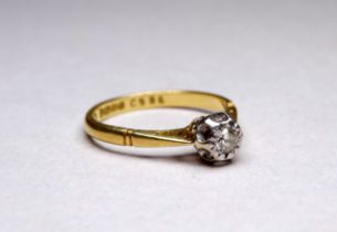 An 18ct yellow gold solitaire diamond ring - with an illusion setting, ring size N, weight 2.7g.
