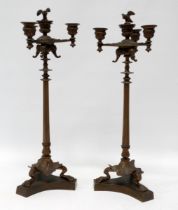 A pair of Italian Renaissance candlesticks - with four sconces and three elephant masks on a