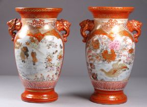 A pair of Meiji period Kutani vases - of baluster form with elephant mask handles and decorated with