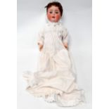 An early 20th century Heubach Koppelsdorf bisque headed doll - with blue sleeping eyes,