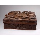 A mid 20th century Indian carved hardwood cigarette box - the hinged lid bearing RAF logo between