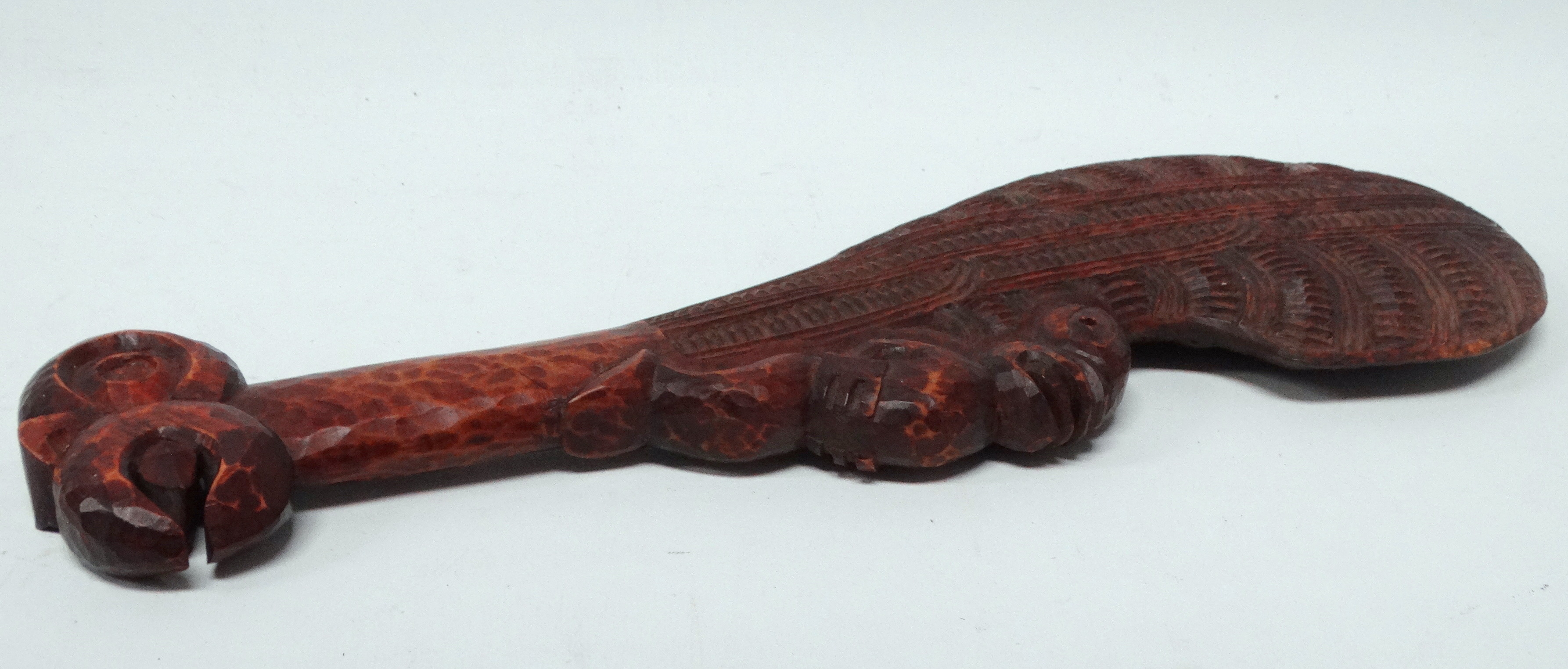 A Maori hand club wahaika - with linear and notched carving to the blade and with a tiki figure to - Image 4 of 4