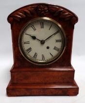 A William IV burr walnut cased mantel timepiece - the stepped case carved with flowers and foliage