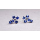 A pair of 18ct white gold diamond and topaz ear studs - cruciform, weight 1.4g.