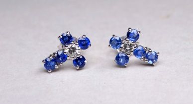 A pair of 18ct white gold diamond and topaz ear studs - cruciform, weight 1.4g.