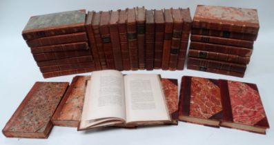 A quantity of leather bound books - mostly religious treatises and a quantity of Punch Library of