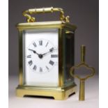 A 20th century carriage timepiece - with a corniche case and white enamel dial set out with Roman