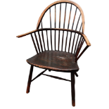 A 19th century ash and elm comb back Windsor chair - with arched top rail with spindle back above