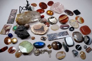 A selection of polished stone samples - together with some crystals and a single 15ct yellow gold