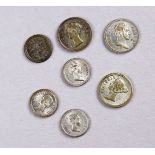 A collection of seven small medallions commemorating Queen Victoria and her children.