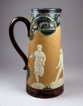 A Royal Doulton salt glazed stoneware jug - decorated in relief with footballers and athletes,