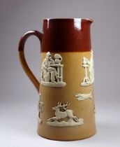 A Doulton Lambeth salt glazed stoneware jug - with applied decoration, to include drinkers, a