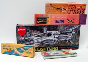 A scale balsa model kit of a Lockheed P-39 Lightning - boxed with instructions, together with four