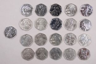 Twenty one collectable 50 pence coins - to include Paddington Bear and Beatrix Potter.