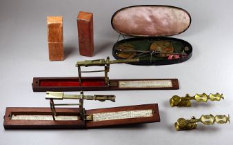 A set of brass and mahogany case sovereign scales - together with a set of brass panned scales,