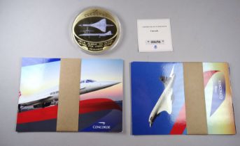 Concorde interest - a Concorde medallion, diameter 7cm and six Concorde postcards.