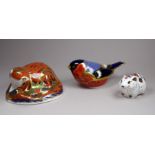 A Royal Crown Derby paperweight - modelled as an otter, width 12cm, together with two further, a