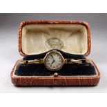 A ladies 9ct yellow gold cased wristwatch - the silvered engine turned dial set out in Arabic