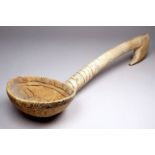 A 19th century Welsh carved hardwood cawl spoon - carved with a sun-burst to bowl with further