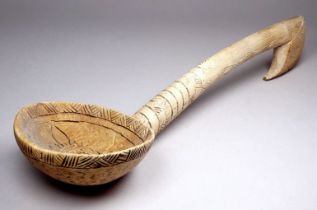 A 19th century Welsh carved hardwood cawl spoon - carved with a sun-burst to bowl with further