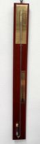 A 20th century mercury stick barometer - mounted on a mahogany panel with brassed scales.