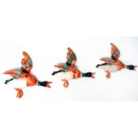 Beswick style flying ducks - three graduated wall hangings in bas relief, largest 26cm (3).