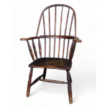 A 19th century ash, elm and beech 'Windsor' chair in the Penwith style - the hooped stick back