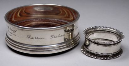 A silver bottle coaster - Birmingham 1984, W I Broadway & Co, diameter 9cm, together with a silver