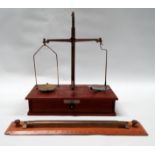 A set of 20th mahogany and brass laboratory balance scales - with brass and glass pans, the base