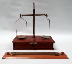 A set of 20th mahogany and brass laboratory balance scales - with brass and glass pans, the base