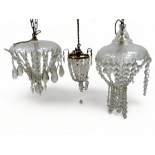 An early 20th century clear glass electrolier - with circular cut glass saucer and bag pendant,