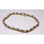A 9ct gold sapphire and diamond bracelet - weight 7.3g.