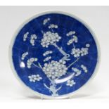 A late 19th century Chinese blue and white plate - with prunus decoration, diameter 30cm.