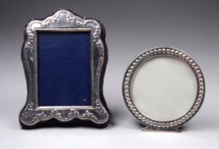 A small silver photograph frame - London 1997, Kitney & Co., height 8cm, together with another