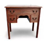 A George III mahogany lowboy - the rectangular top above an arrangement of three drawers, on