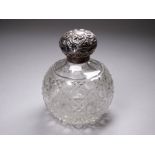 A silver topped cut glass globular dressing table bottle - Birmingham 1906, William Devenport,