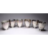 A set of six early 20th century German white metal tumblers - the circular base with a cast leaf