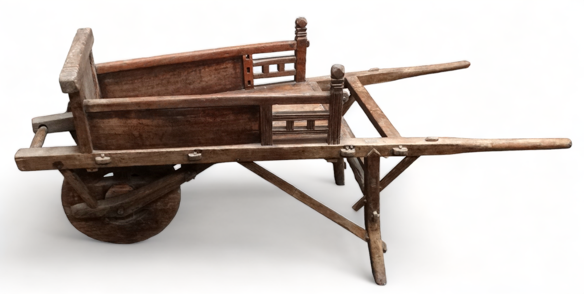 A late 19th century oriental elm wheelbarrow - length 58cm.