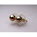 A pair of 9ct gold ear studs - weight 0.7g.