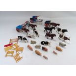 A collection of Britains farm animals - including horses, cattle and pigs, together with various