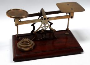 A set of early 19th century Avery brass balance scales - on a rectangular mahogany base