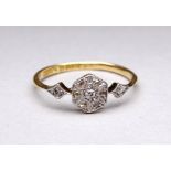 An 18ct gold diamond set ring - hexagonal plaque setting with navette shaped shoulders, weight 2.