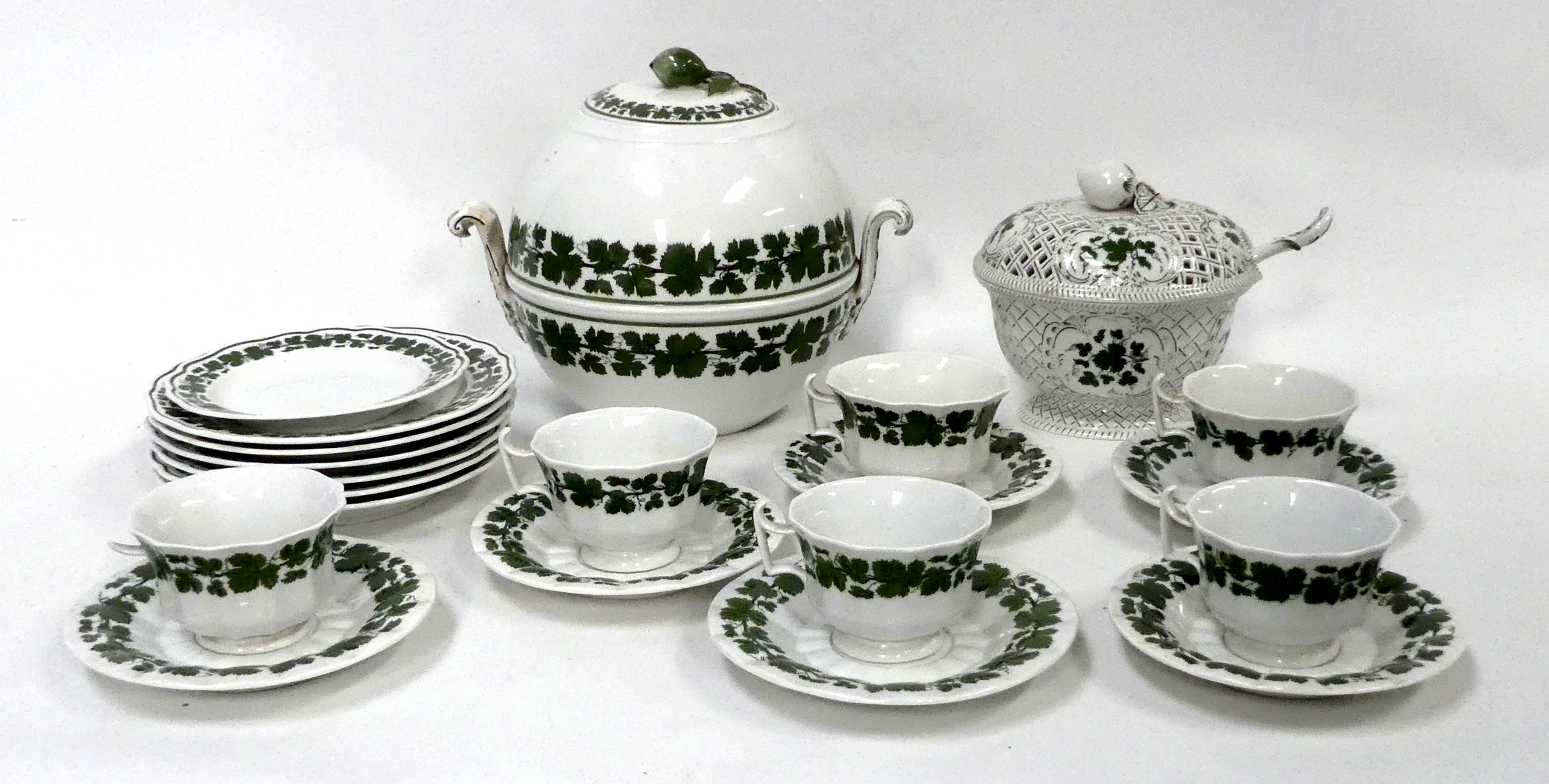 A Meissen part dinner service - decorated with vine leaves, including a globe shaped tureen,