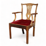 A George III mahogany open arm chair - with a pierced vase shaped splat above a slip-in seat, on