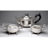 A silver three piece tea service - Birmingham 1924, John Rose, the teapot with ebonised handle and