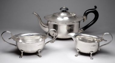 A silver three piece tea service - Birmingham 1924, John Rose, the teapot with ebonised handle and