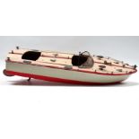 A 1960's Japanese NBK battery powered motorboat - cream hull and red below waterline, with chrome